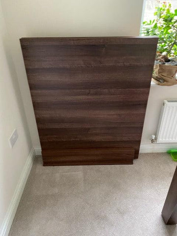 Driftwood dining table top stand holding two removable panels